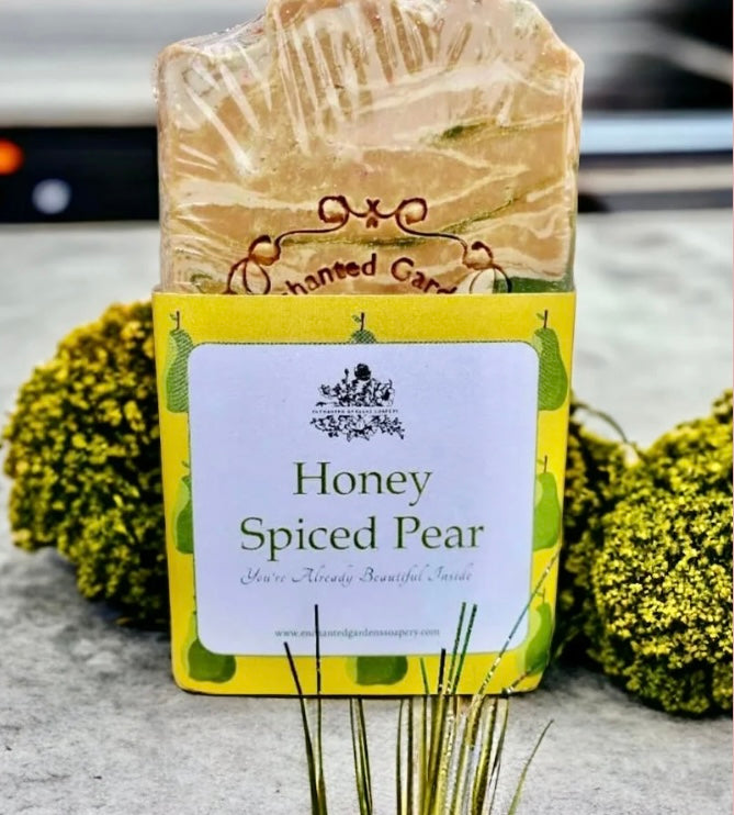 A tan colored bar of handmade honey spiced pear soap from enchanted gardens soapery.